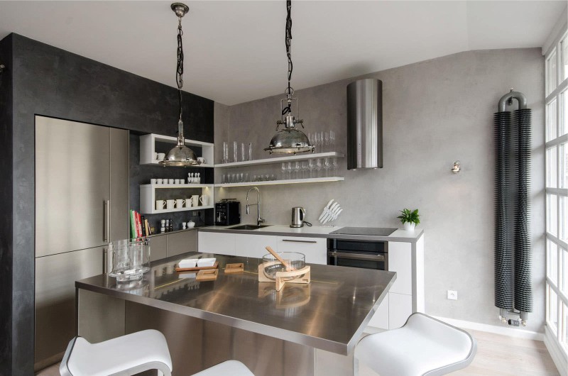 Concrete walls in the interior of high-tech kitchen