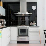 Apron black in white kitchen