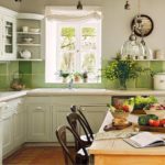 Green apron of ceramic tiles in the kitchen in the style of Provence