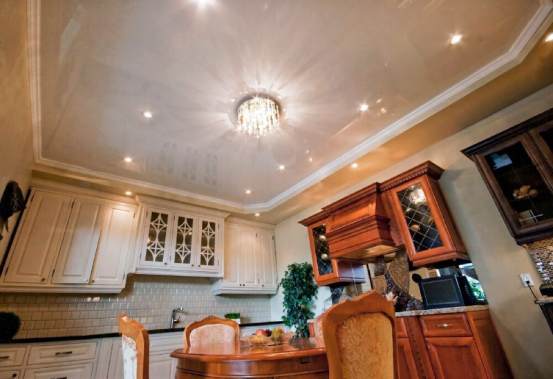 Glossy ceiling in the interior of a classic kitchen