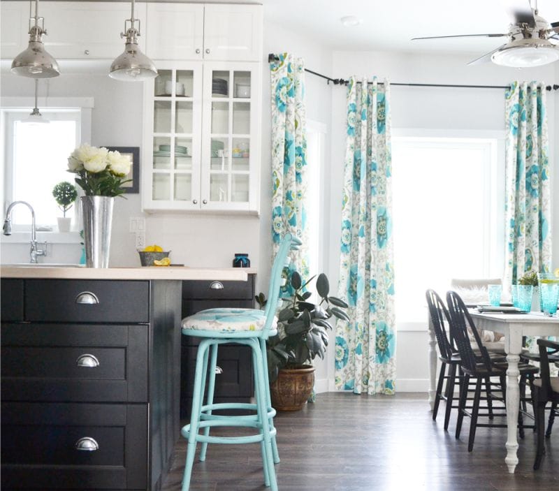 Blue curtains in the interior of the kitchen