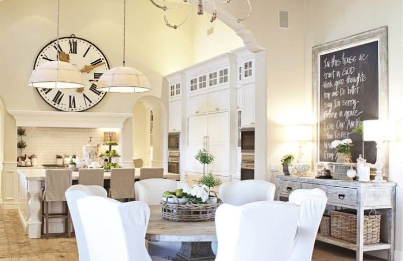 Large clock in the interior of the spacious kitchen-living room