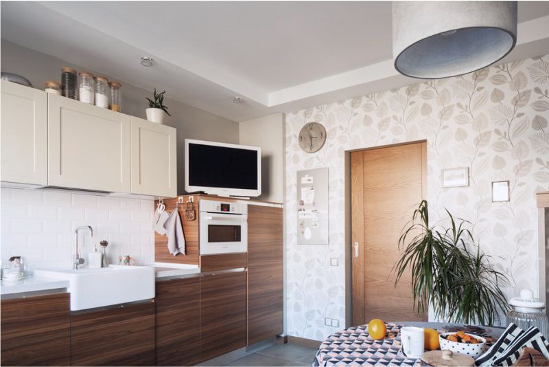 Brown kitchen with beige wallpaper