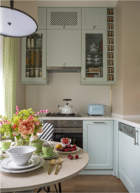 Mint kitchen with light wallpaper
