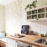 Light green wallpaper in the interior of the kitchen