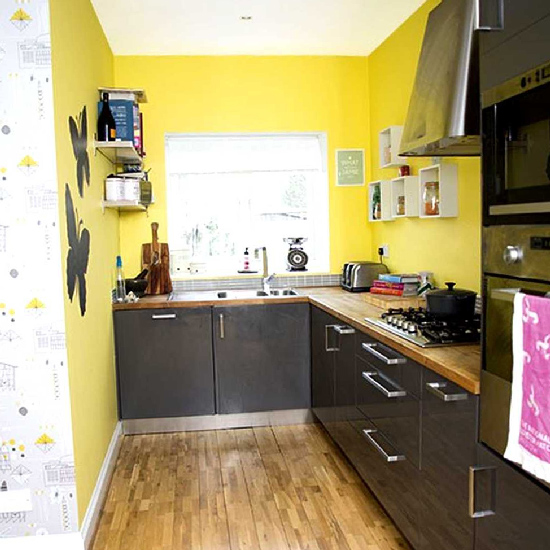 Yellow wallpapers and black kitchen